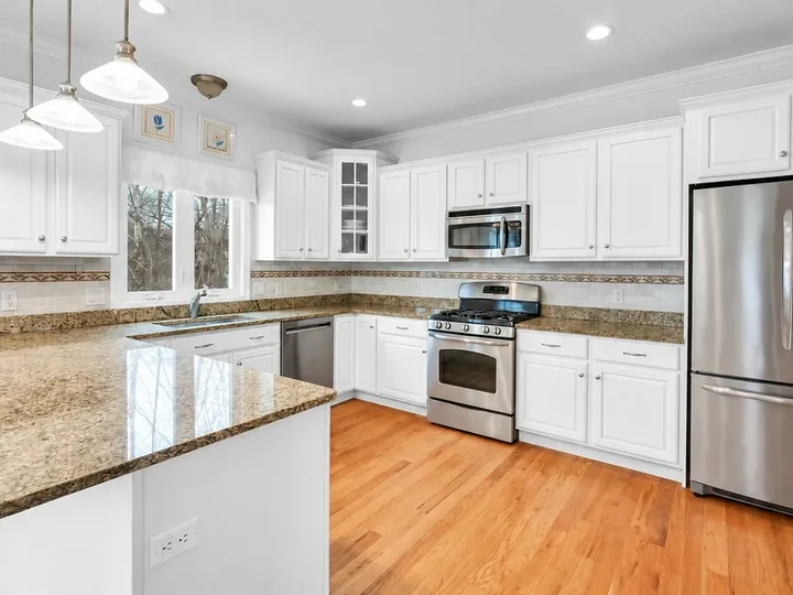 Kitchen cabinets sprayed white in a Bristol CT kitchen